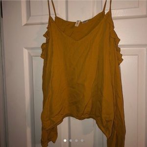 Mustard yellow open shoulder blouse.